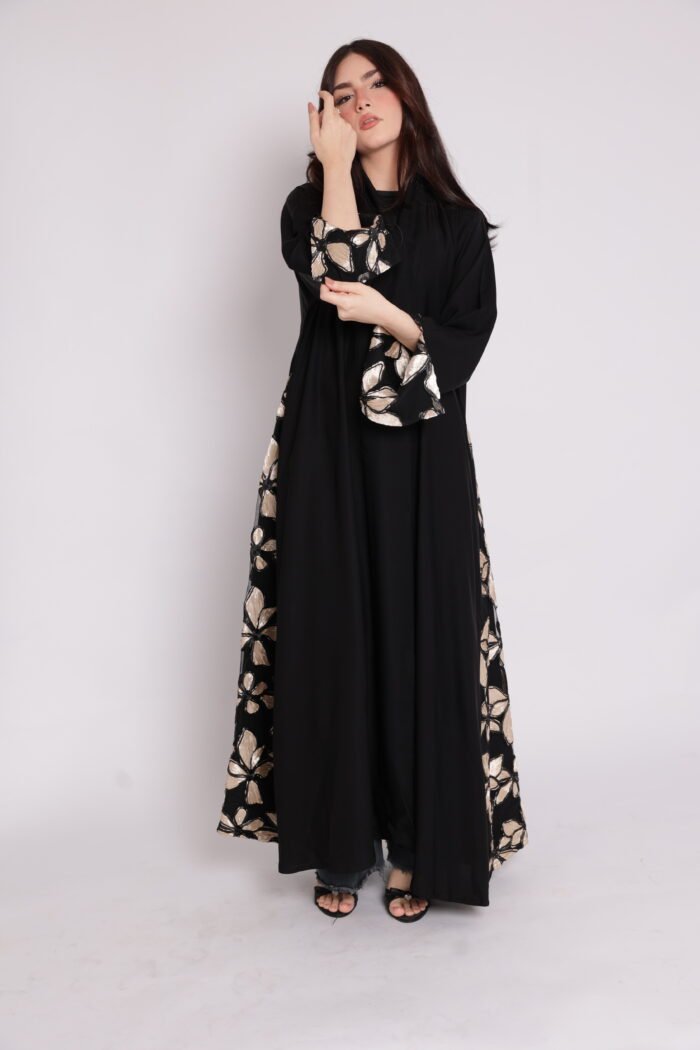 Black abaya with side embroidery and cufflinks decorated with shiny floral patterns in gold and beige - Image 1