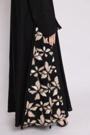 Black abaya with side embroidery and cufflinks decorated with shiny floral patterns in gold and beige - Image 5